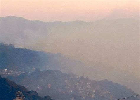 Public warned vs smog caused by forest, bush fires in Baguio, Benguet.